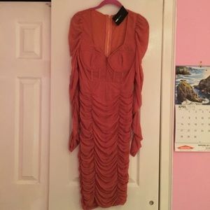 Salmon color dress.